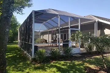 White mansard screen enclosure by East Coast Aluminum
